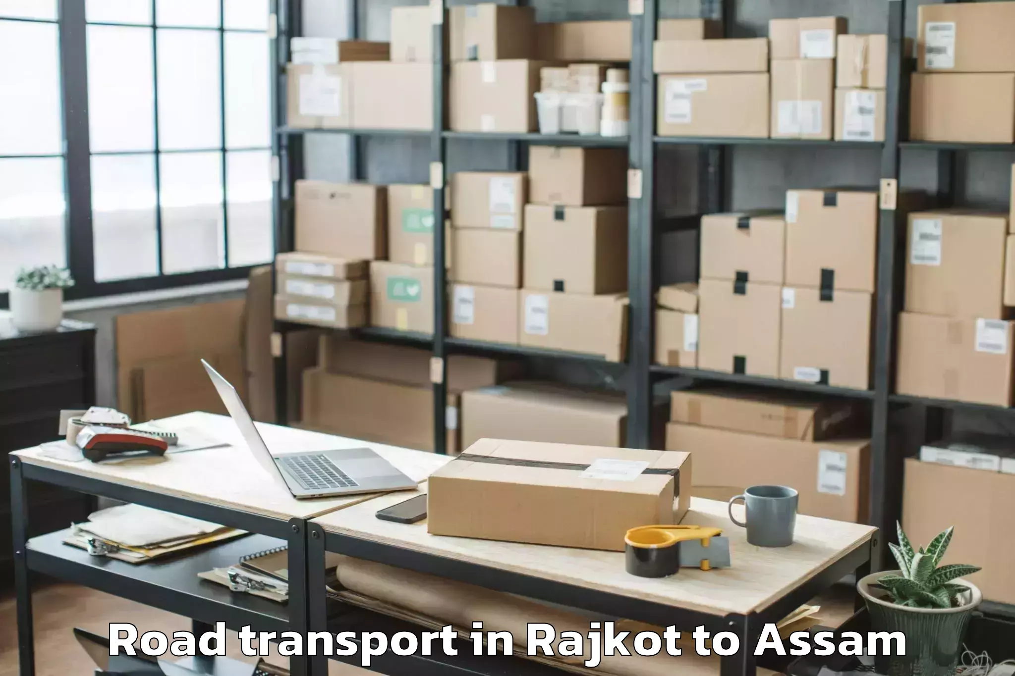 Quality Rajkot to Dhakuakhana Road Transport